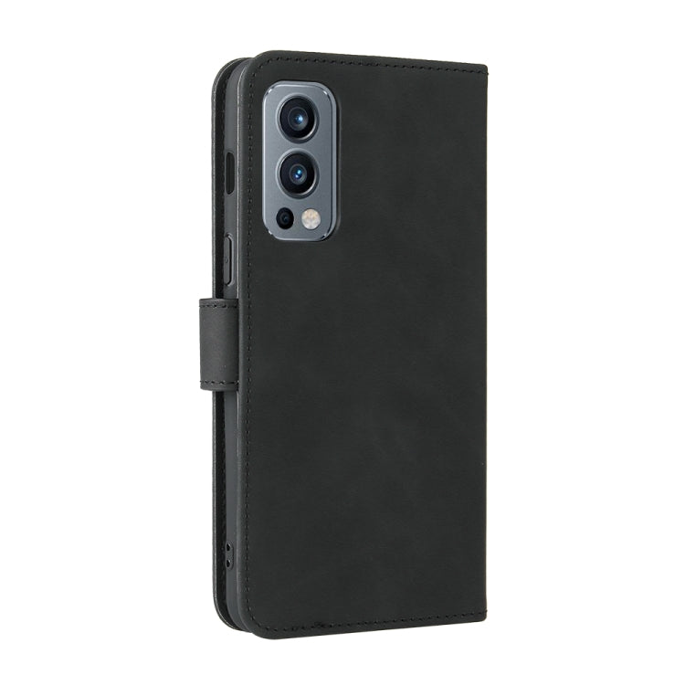 Solid Color Skin Feel Magnetic Buckle Horizontal Flip Calf Texture PU Leather Case with Holder & Card Slots & Wallet, For OnePlus Nord 2 5G
